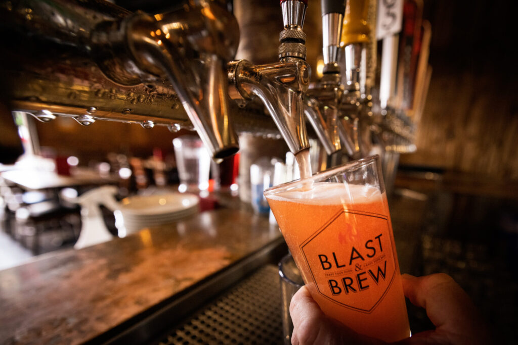 Pouring beer into a glass.