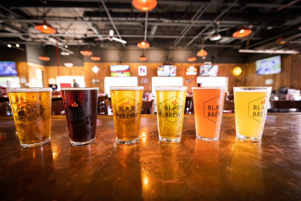 6 different beers on the bar.