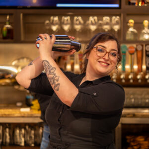 Bartender making a cocktail.