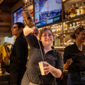 Bartender making a drink.