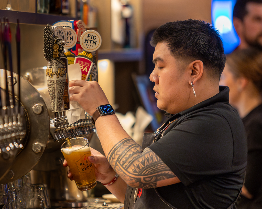 Pouring beer.