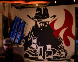 Cowboy painting on the wall.