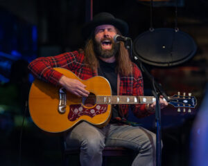 Guy playing a guitar.